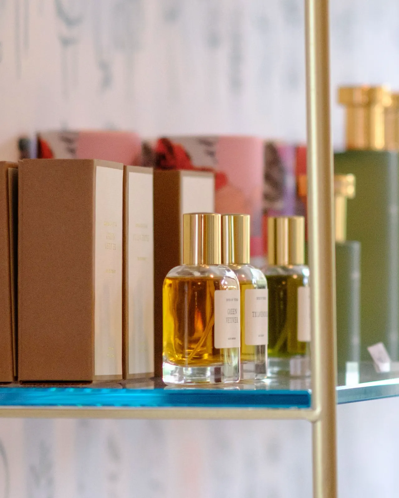 Fragrances on a shelf along the back wall.